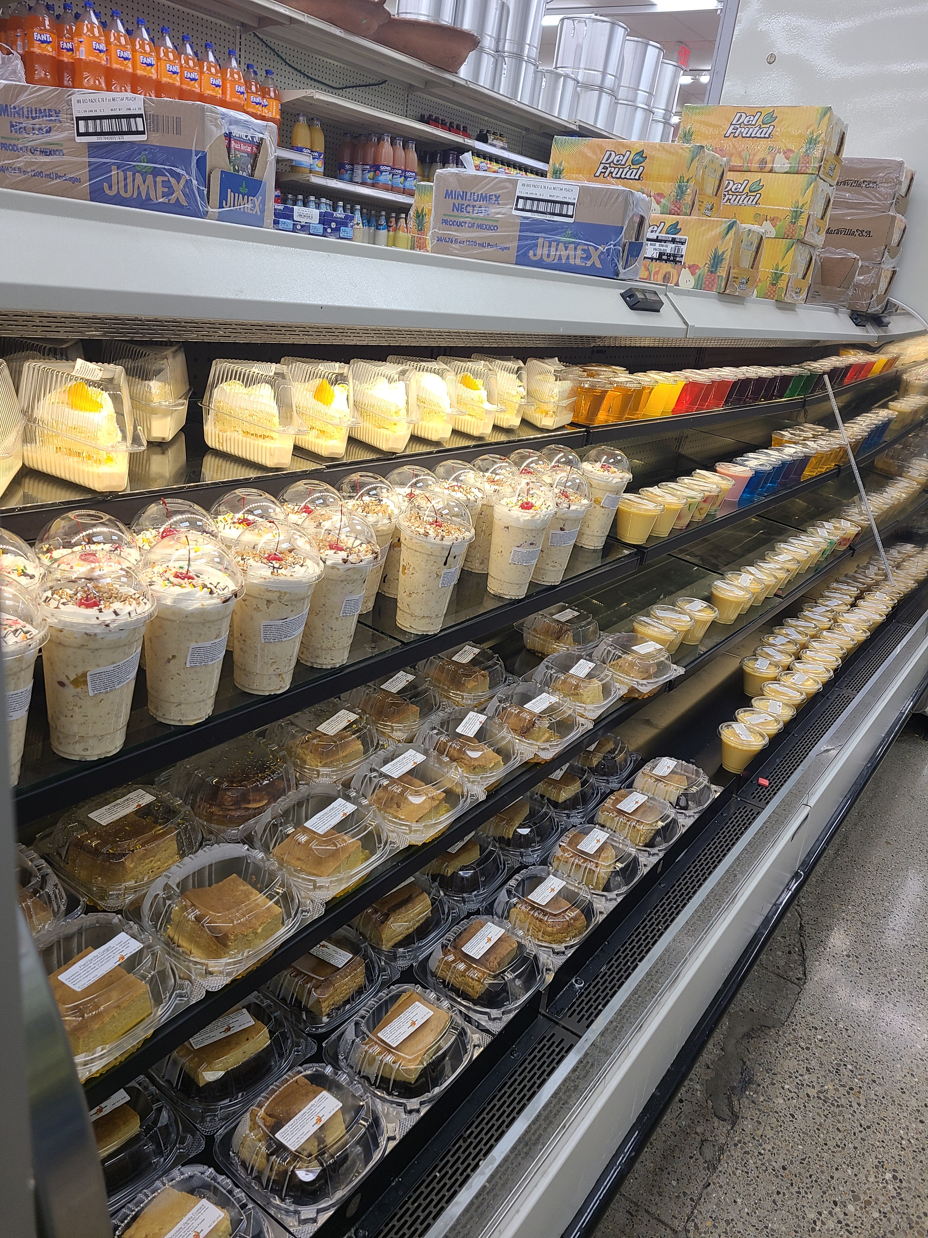 Fresh pan dulce, pastries, and traditional Mexican bakery items inside the Panadería at El Gran Valle Verde, a Hispanic grocery store in Hamilton, Ohio.